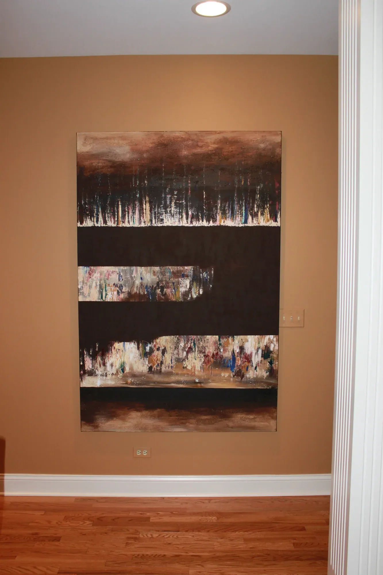 Dark abstract painting with layered collage elements