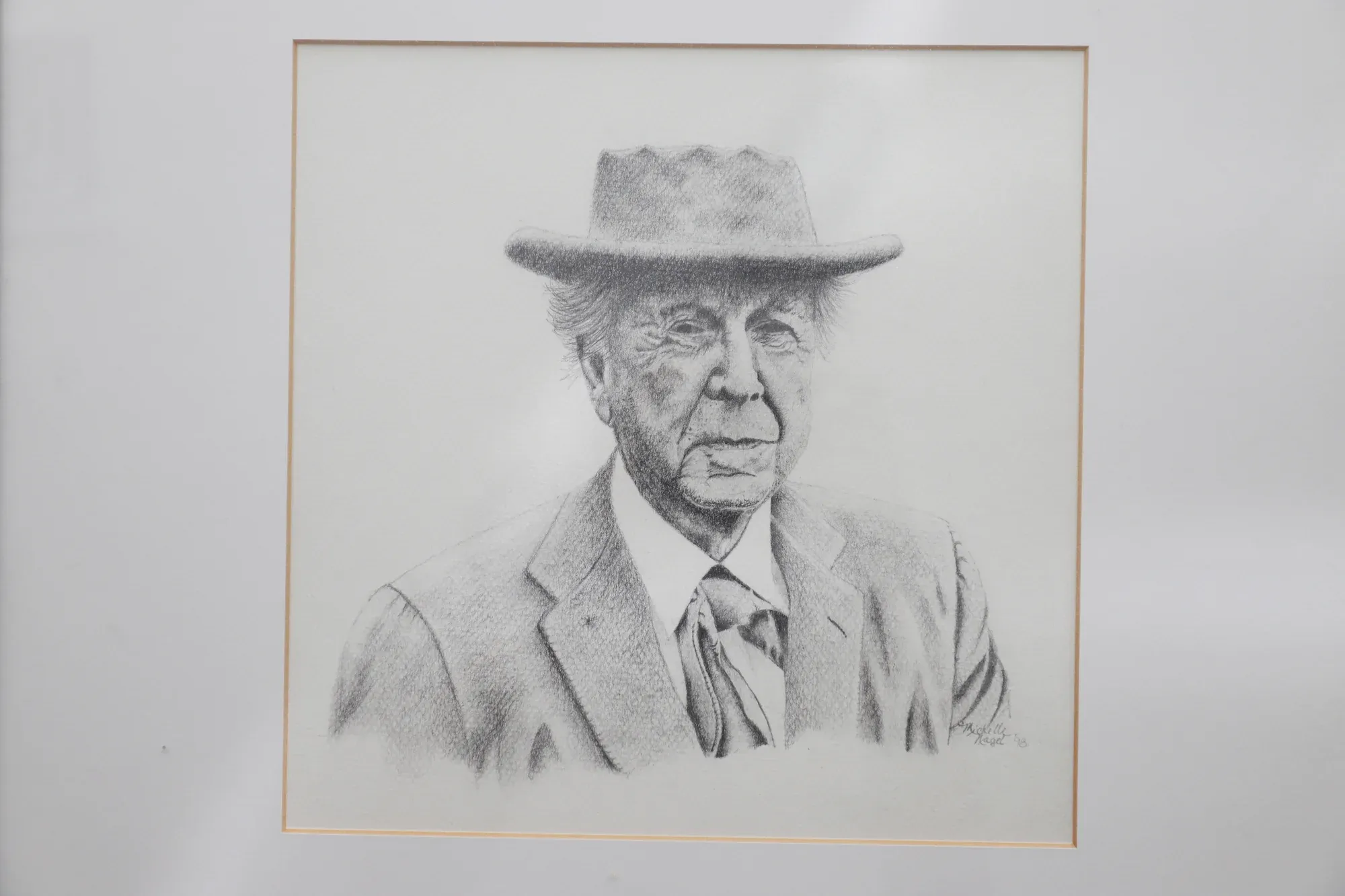 Graphite portrait sketch of a man in a hat
